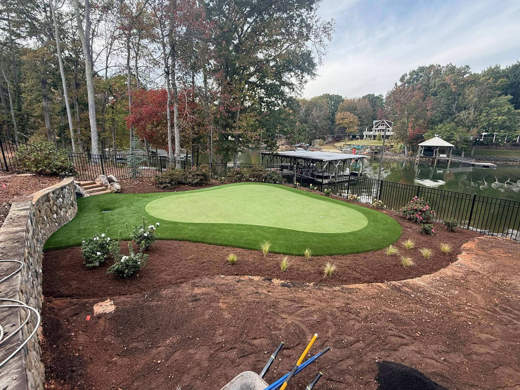 Fort Mill area putting green installation using artificial turf for durable, realistic short-game practice.