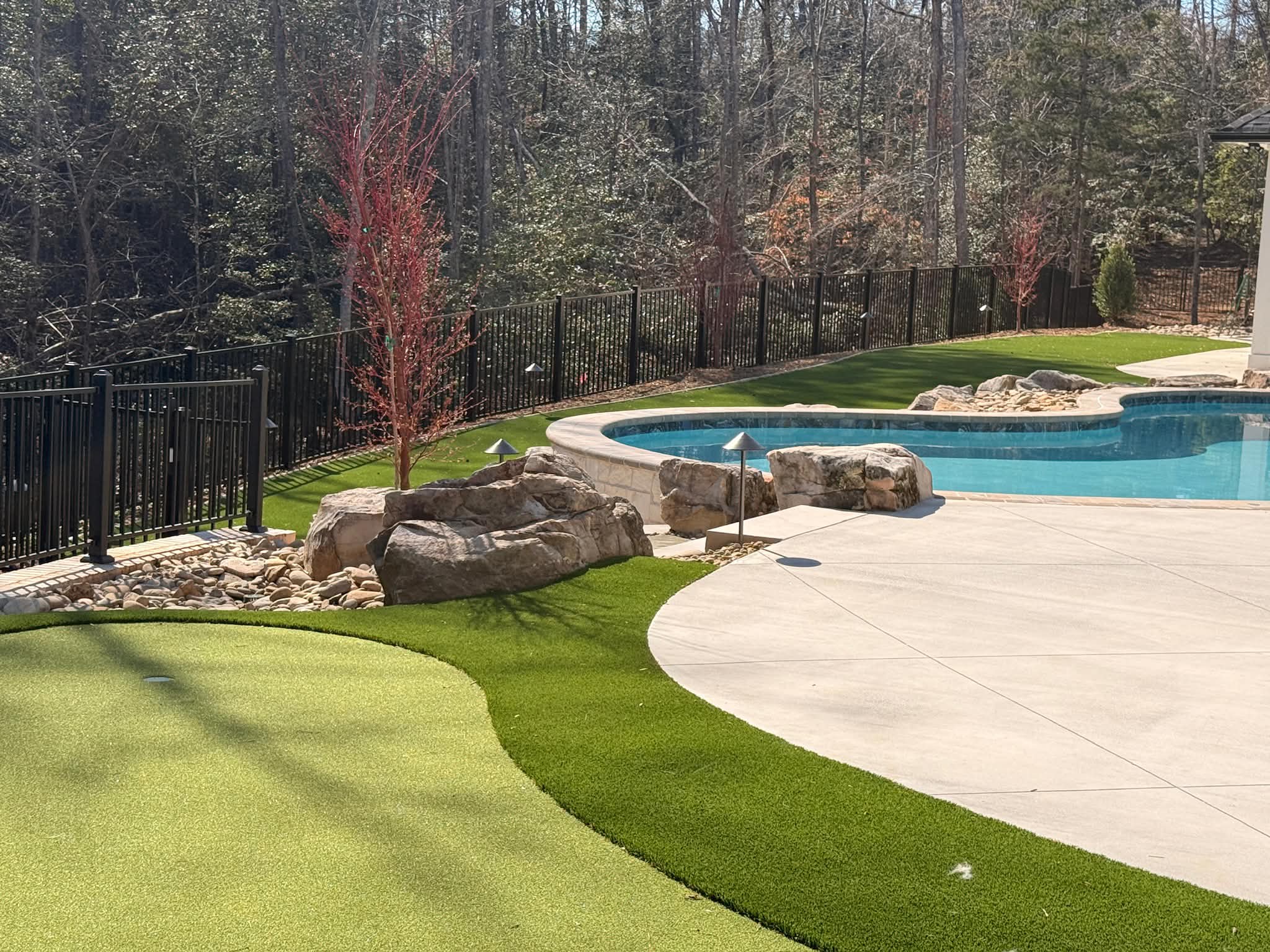 Residential golf green installation near Fort Mill, combining synthetic turf durability with a clean backyard design.