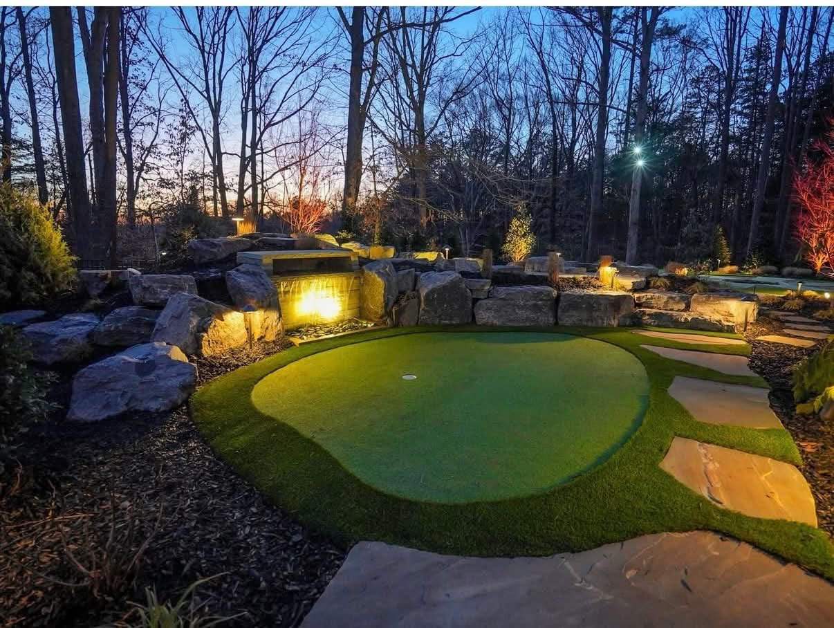 Custom backyard putting green with artificial grass, built for a clean finished look and practical use in Fort Mill.